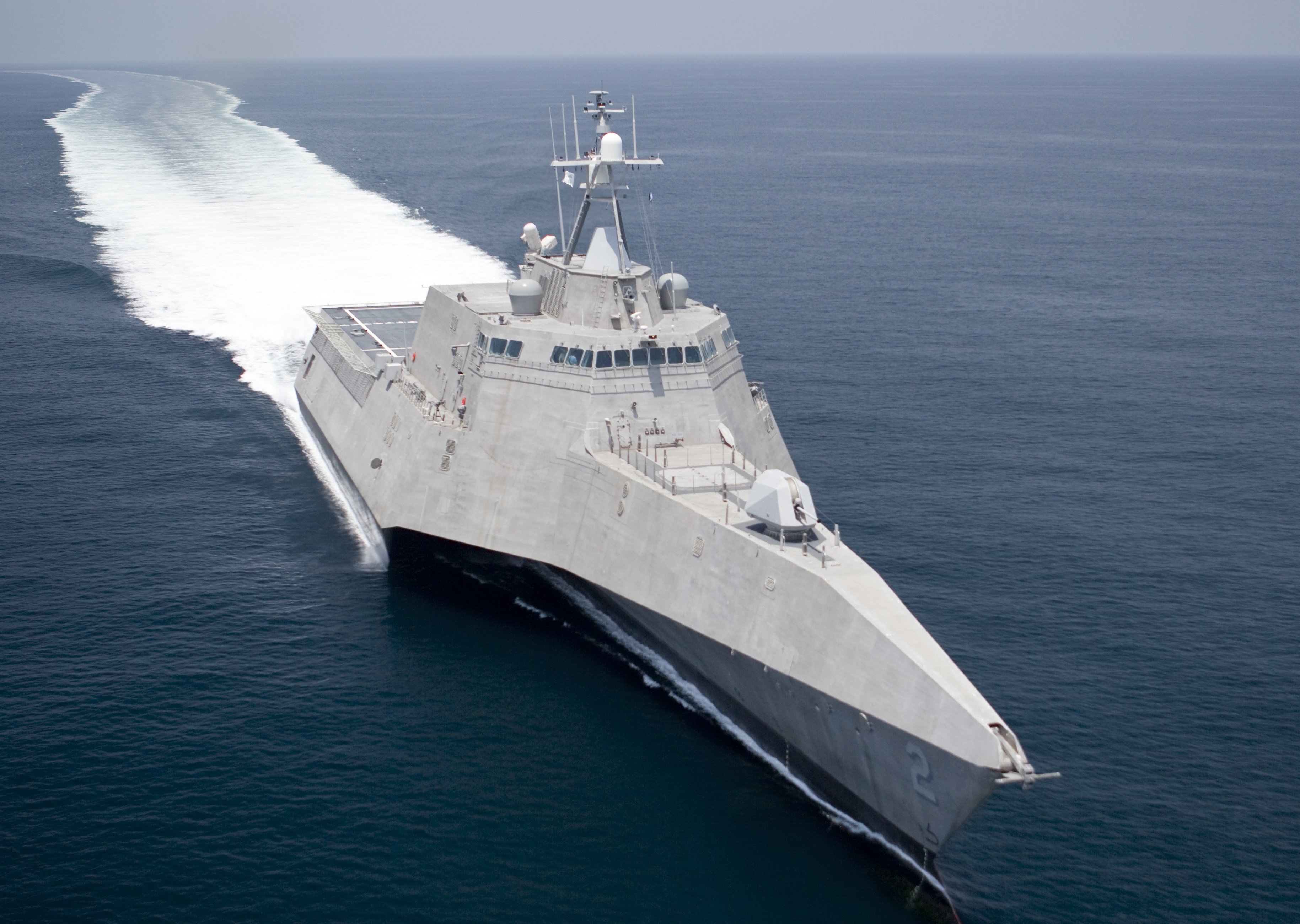 The USS Independence cuts through the water.