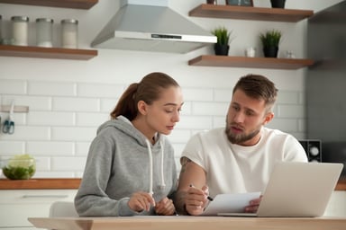 worried couple at laptop_GettyImages-916126732