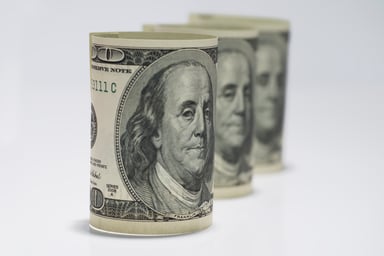 Three one hundred dollar rolls