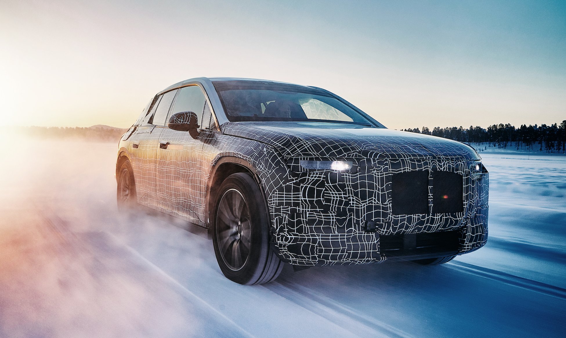 A prototype BMW iNEXT, a big electric luxury SUV, shown undergoing winter testing.
