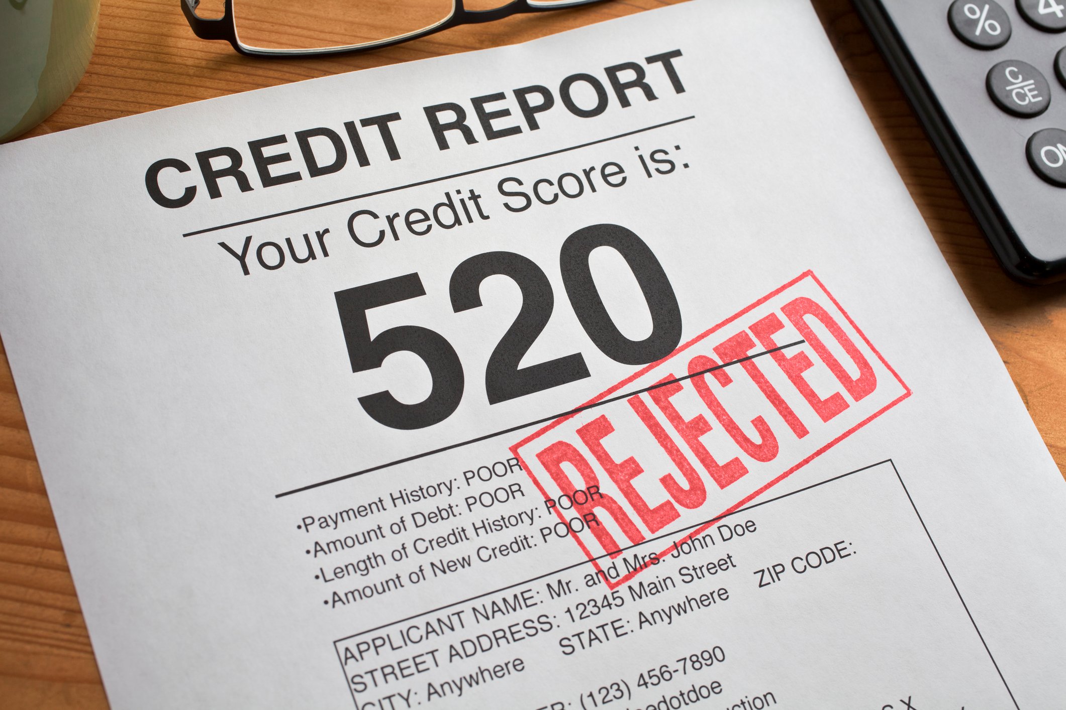 Credit report with "rejected" stamp.