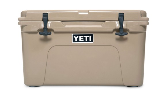Beige ice cooler labeled Yeti.