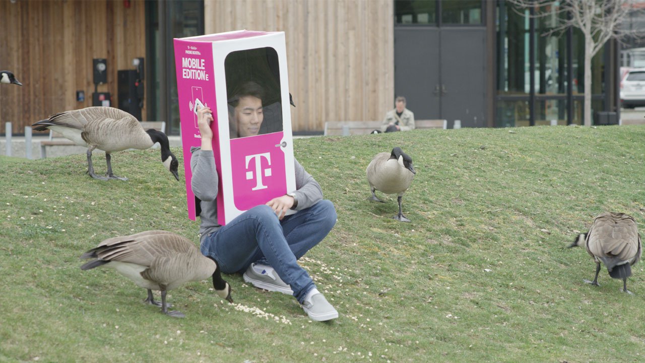 A person wears a T-Mobile Phone BoothE.