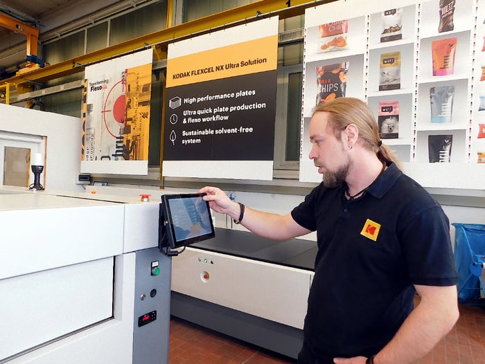 Man using printing process machine