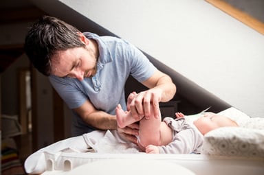 man changing a diaper_GettyImages-532336428
