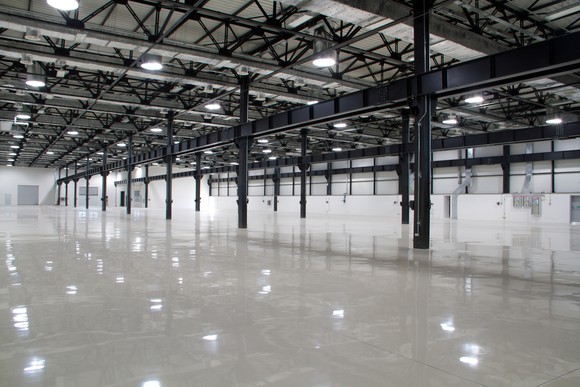 Industrial lighting in empty modern factory.