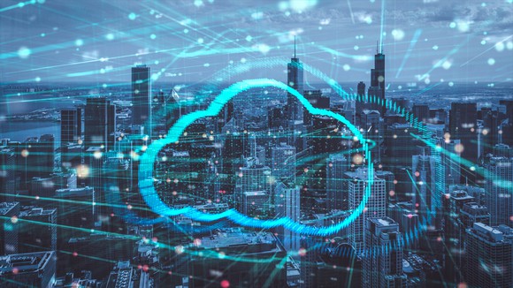 A cloud icon in front of a city landscape.