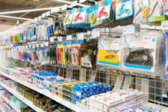 Office supplies on a shelf at a retail store.