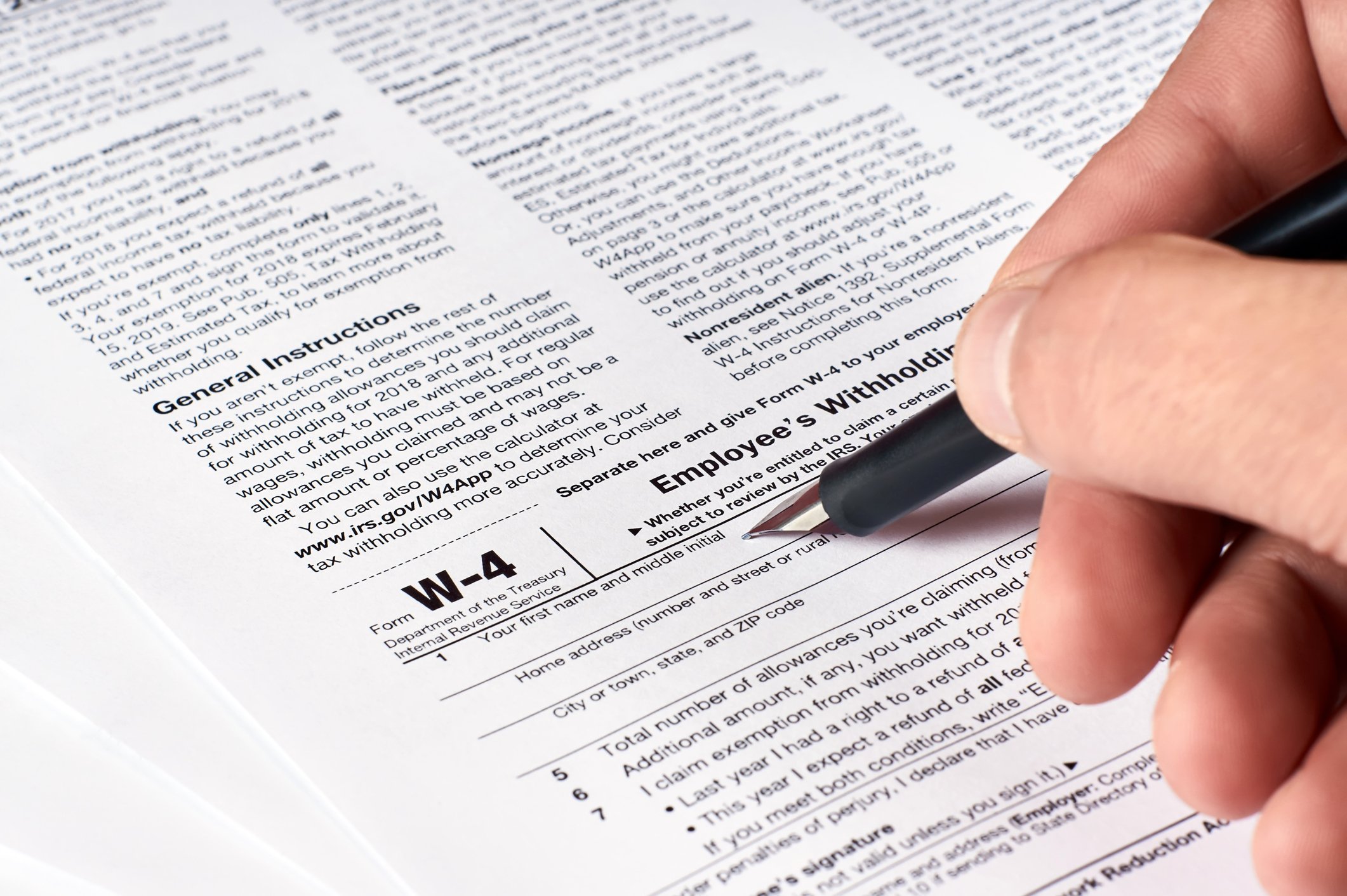 Person filling out Form W-4