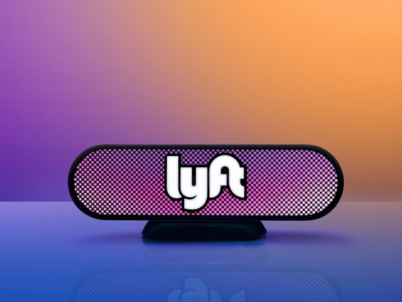 Stylized rear-view mirror graphic with Lyft logo.