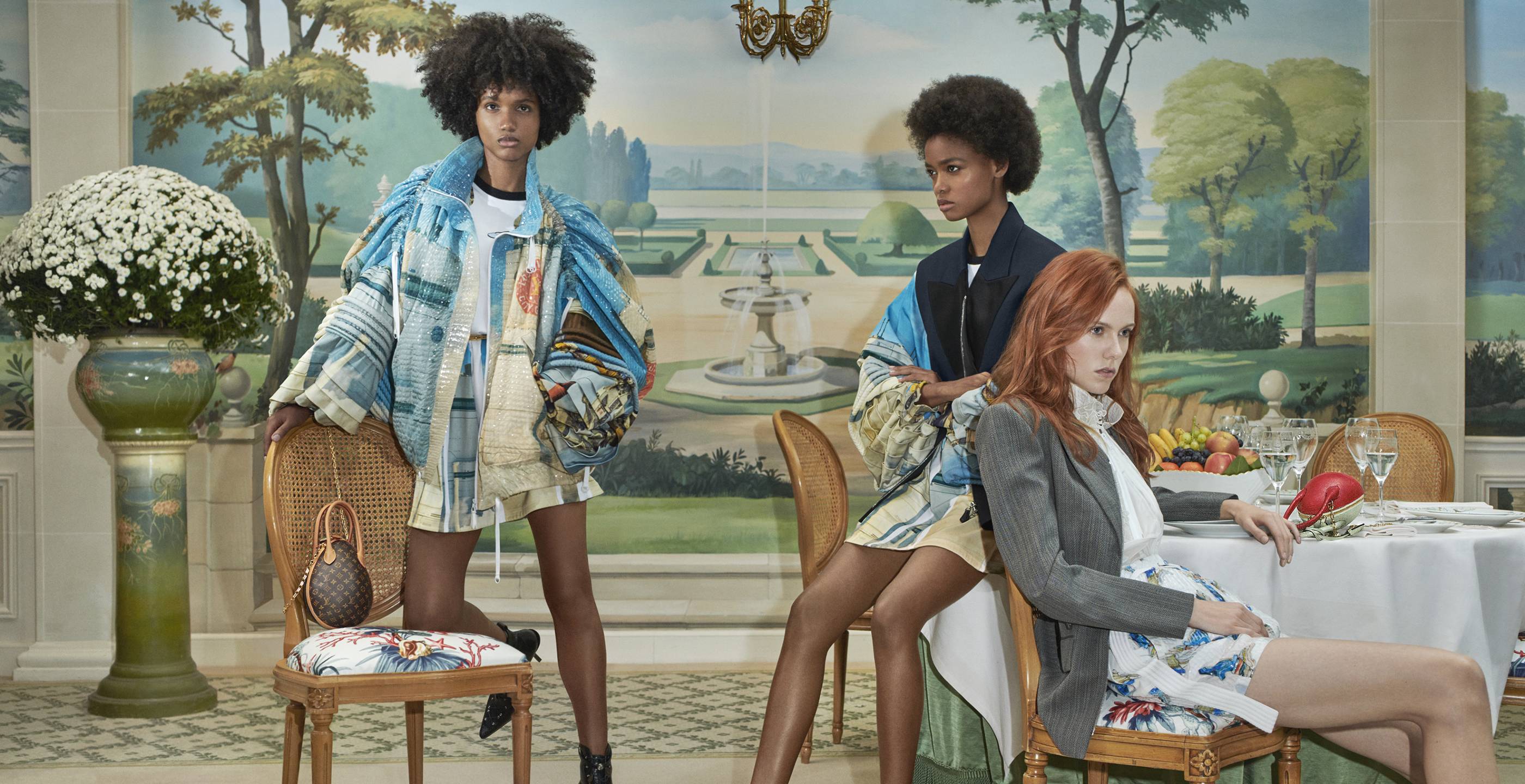 Three women in a Louis Vuitton ad campaign.