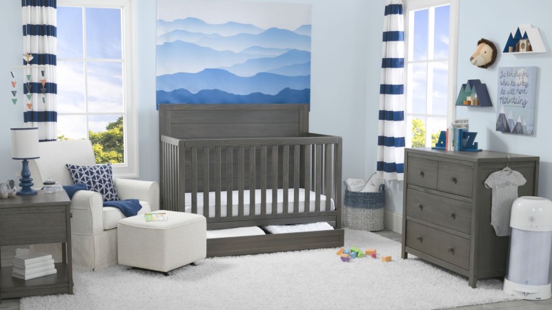 A baby's room in blue and grey