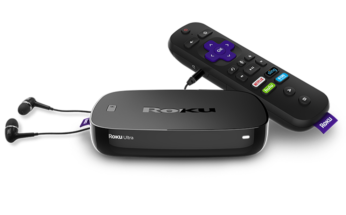 A shot of Roku's Ultra streaming video players with a remote and ear buds.