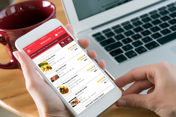 A customer uses Grubhub's mobile app.