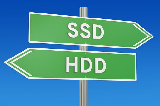 Road signs pointing to SSD and HDD