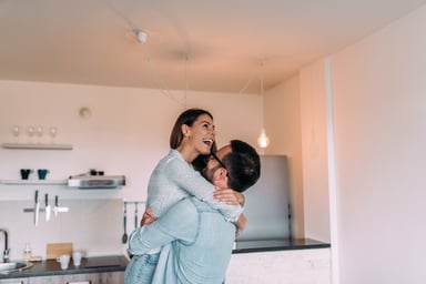 young couple in kitchen_GettyImages-964372222