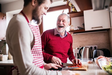 father and son cooking_GettyImages-906715880