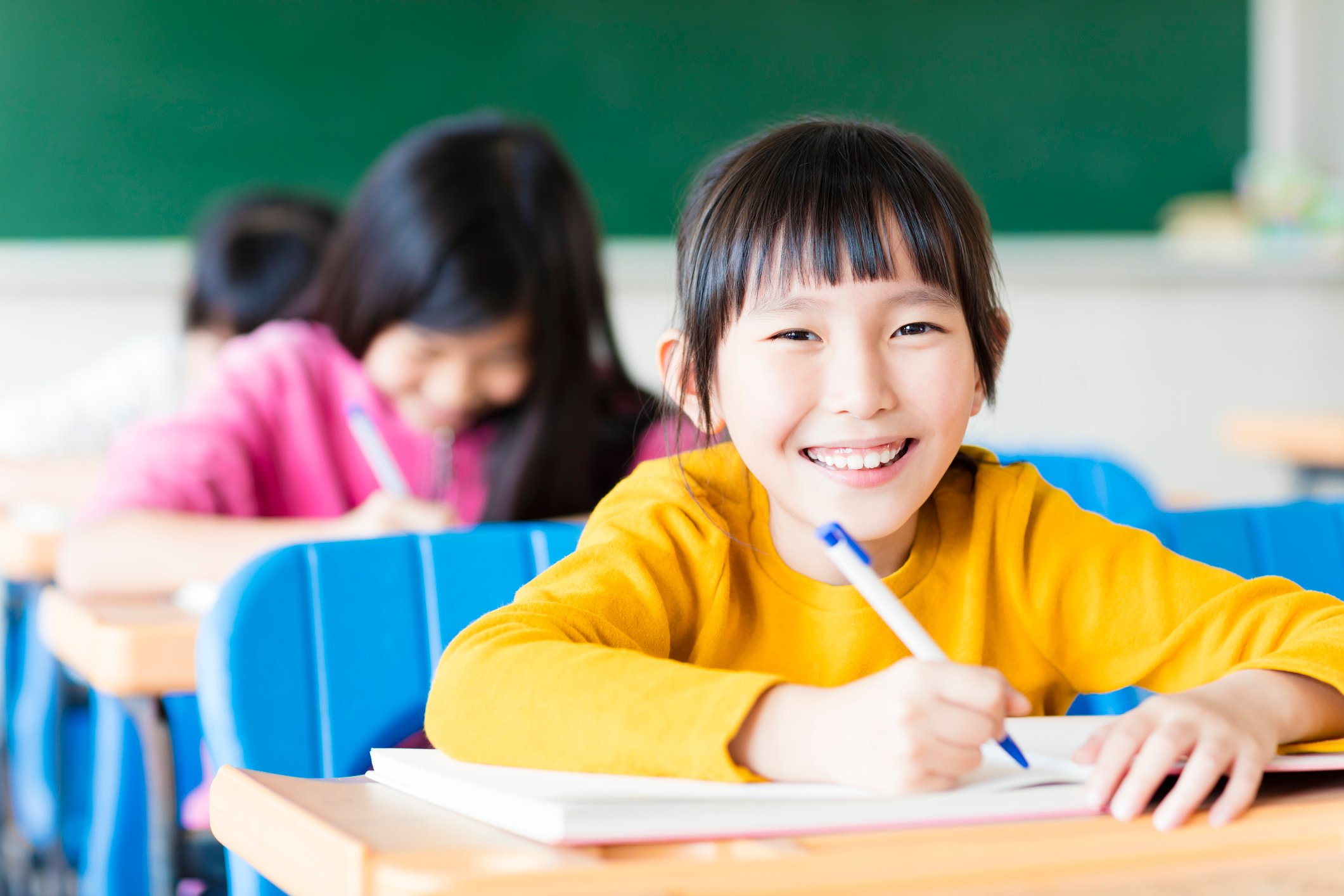 Middle school girl at her desk