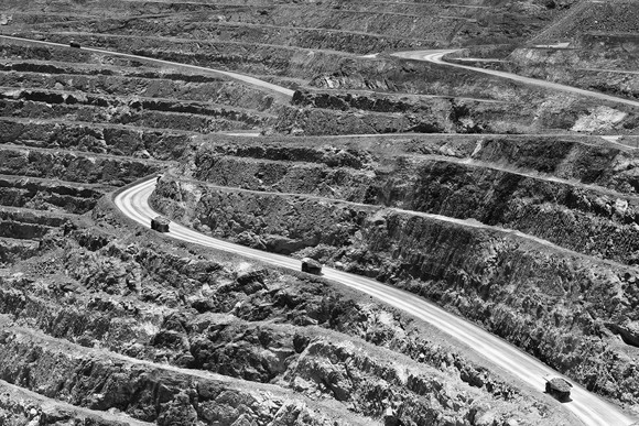 Trucks on an access road of a mine