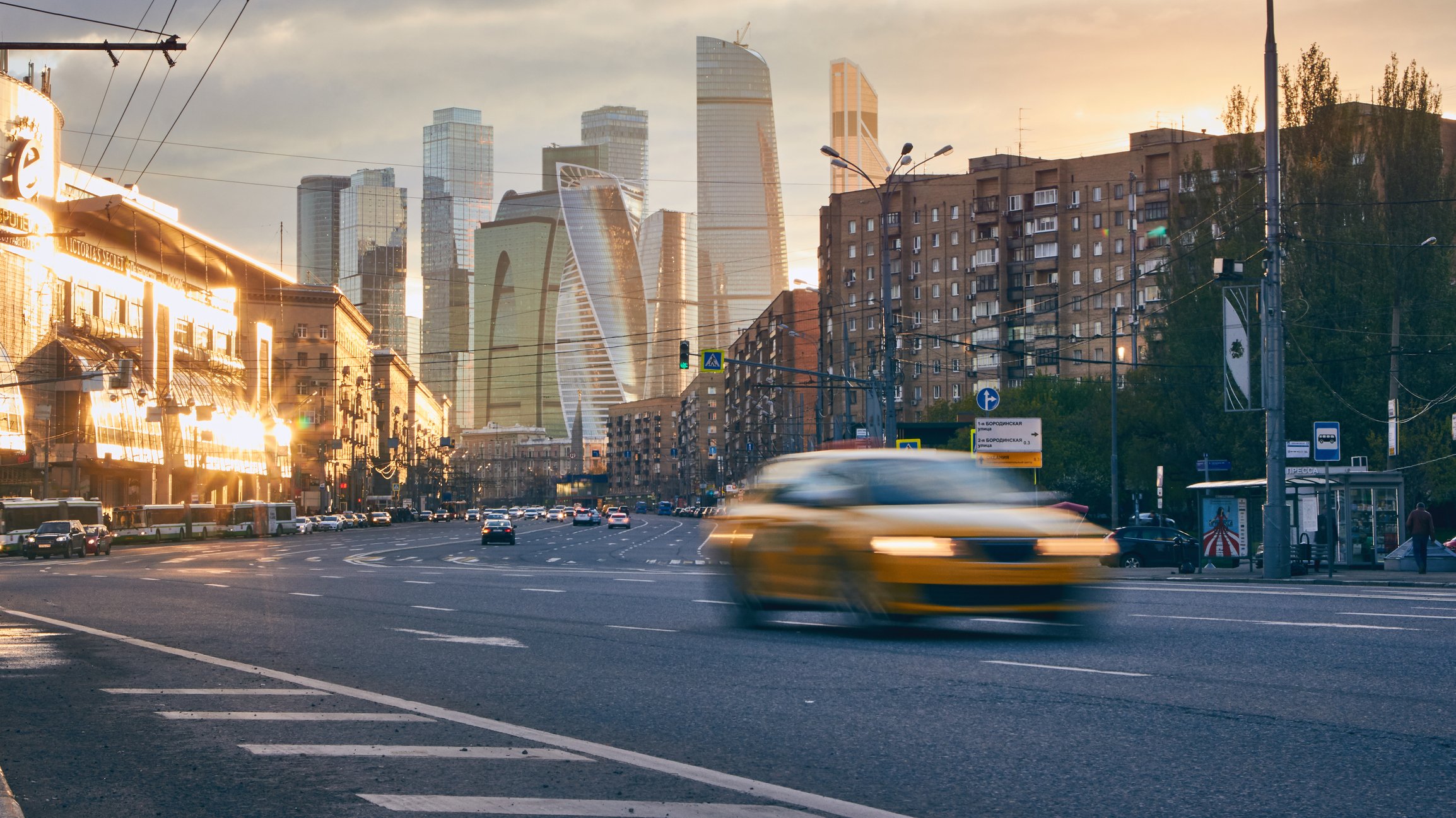 The Moscow skyline with a taxi in the foreground.