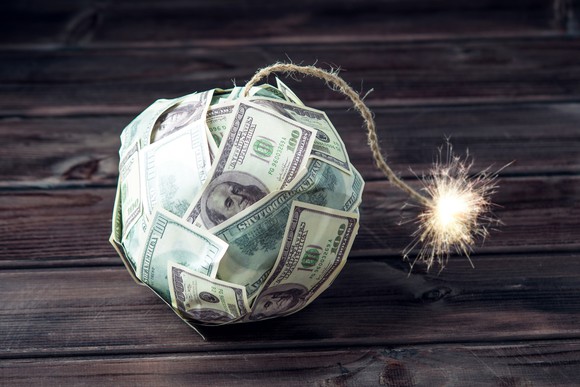 Bomb made of hundred dollarbills with a lit fuse