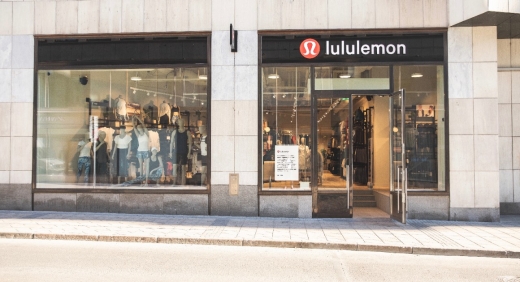 The shopfront of a Lululemon store with open doors