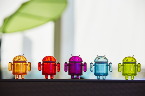 A row of glass Android figurines.