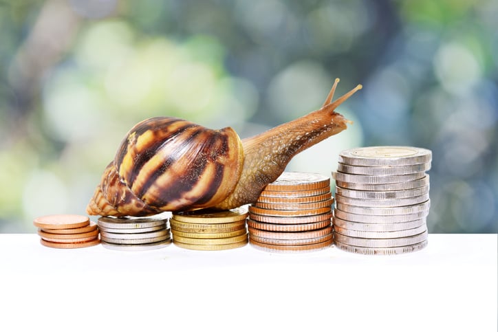 A snail climbing up ascending stacks of coins.