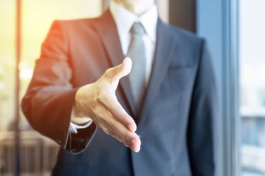 man extending handshake_GettyImages-1035881212