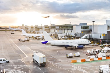 Busy Airport with Planes and Service Vehicles