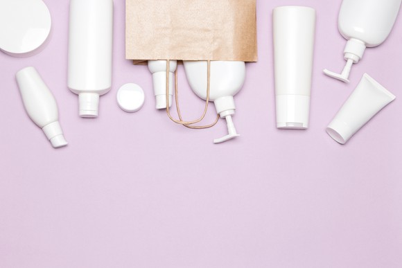 An assortment of skin-care products on a desk.
