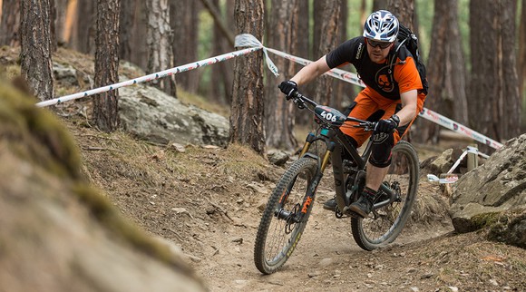 A Fox Factory rider on a mountain bike