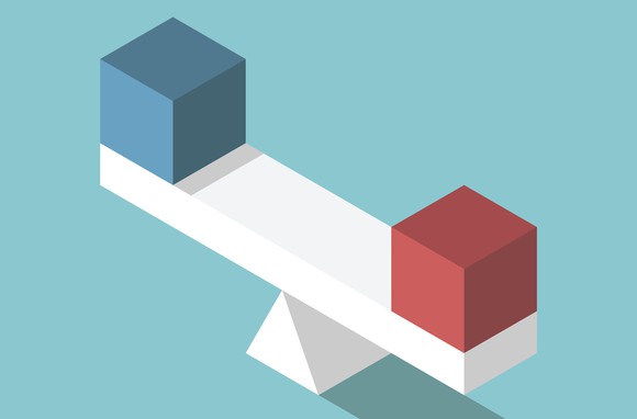 Two blocks sitting on a scale.