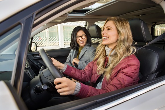 A Lyft driver and a passenger inside a car