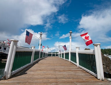 walkway with U.S. and Canadian flags