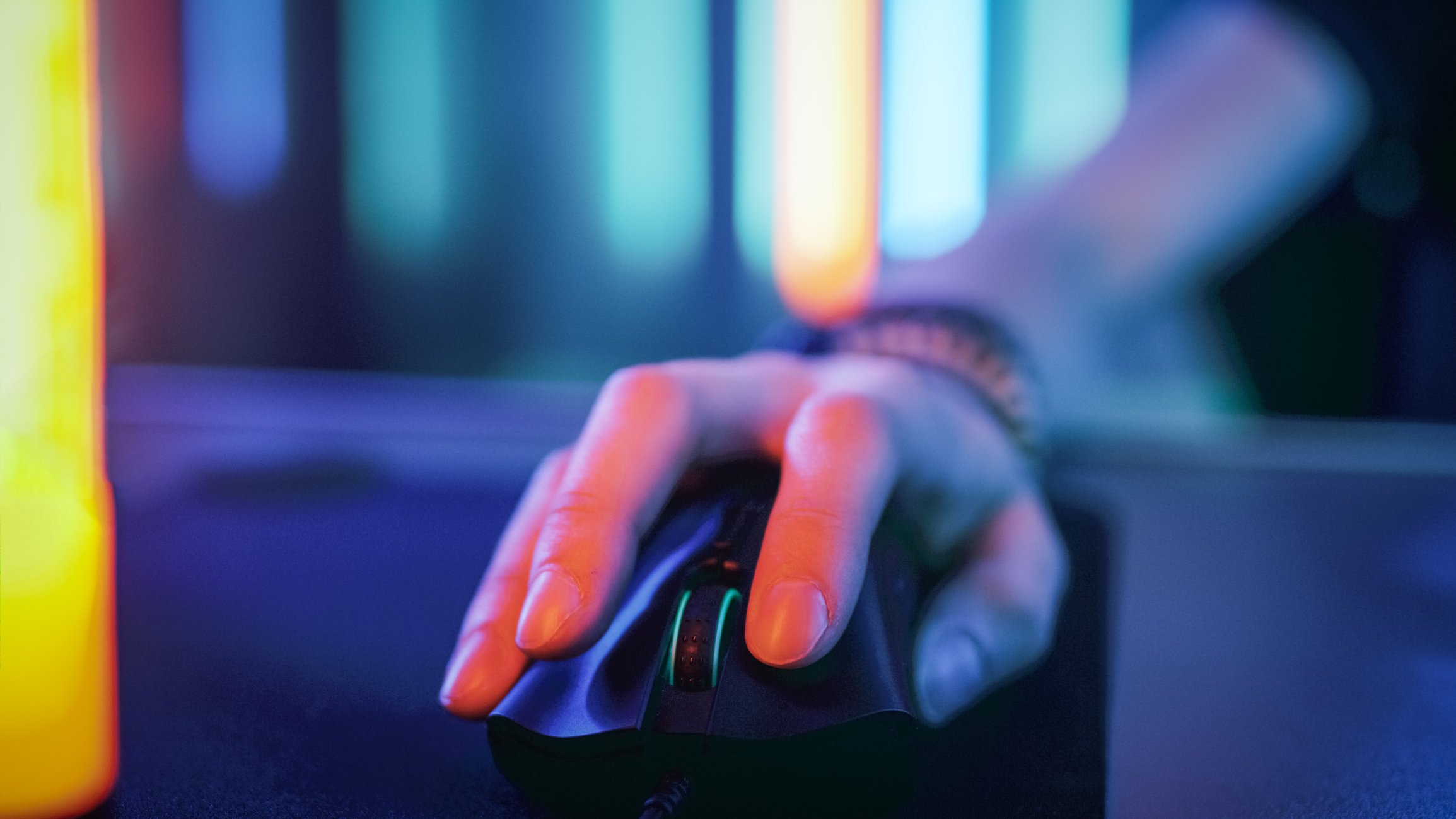 A hand on a computer mouse.