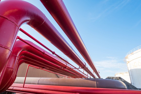 Red pipelines at an oil storage terminal.