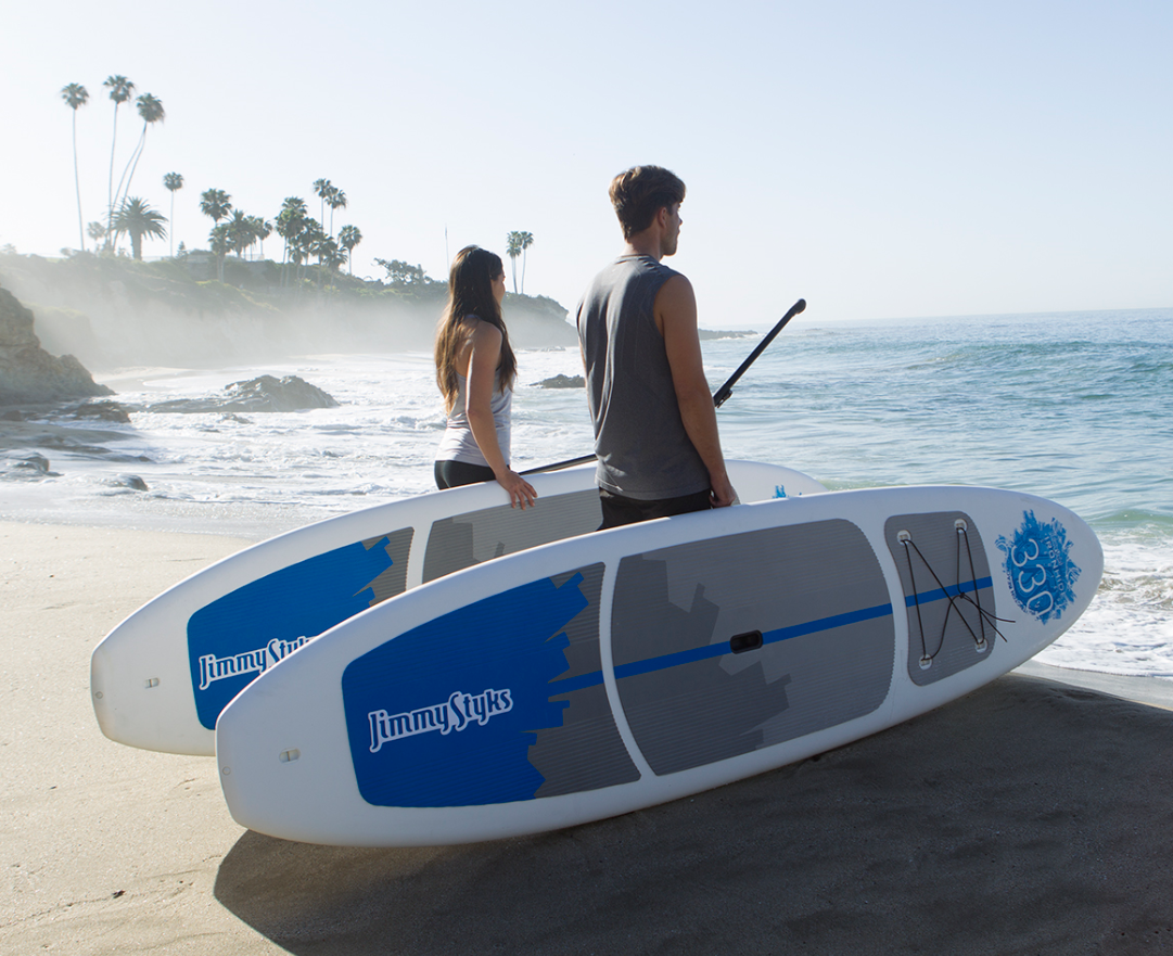 Couple with stand-up paddle boards