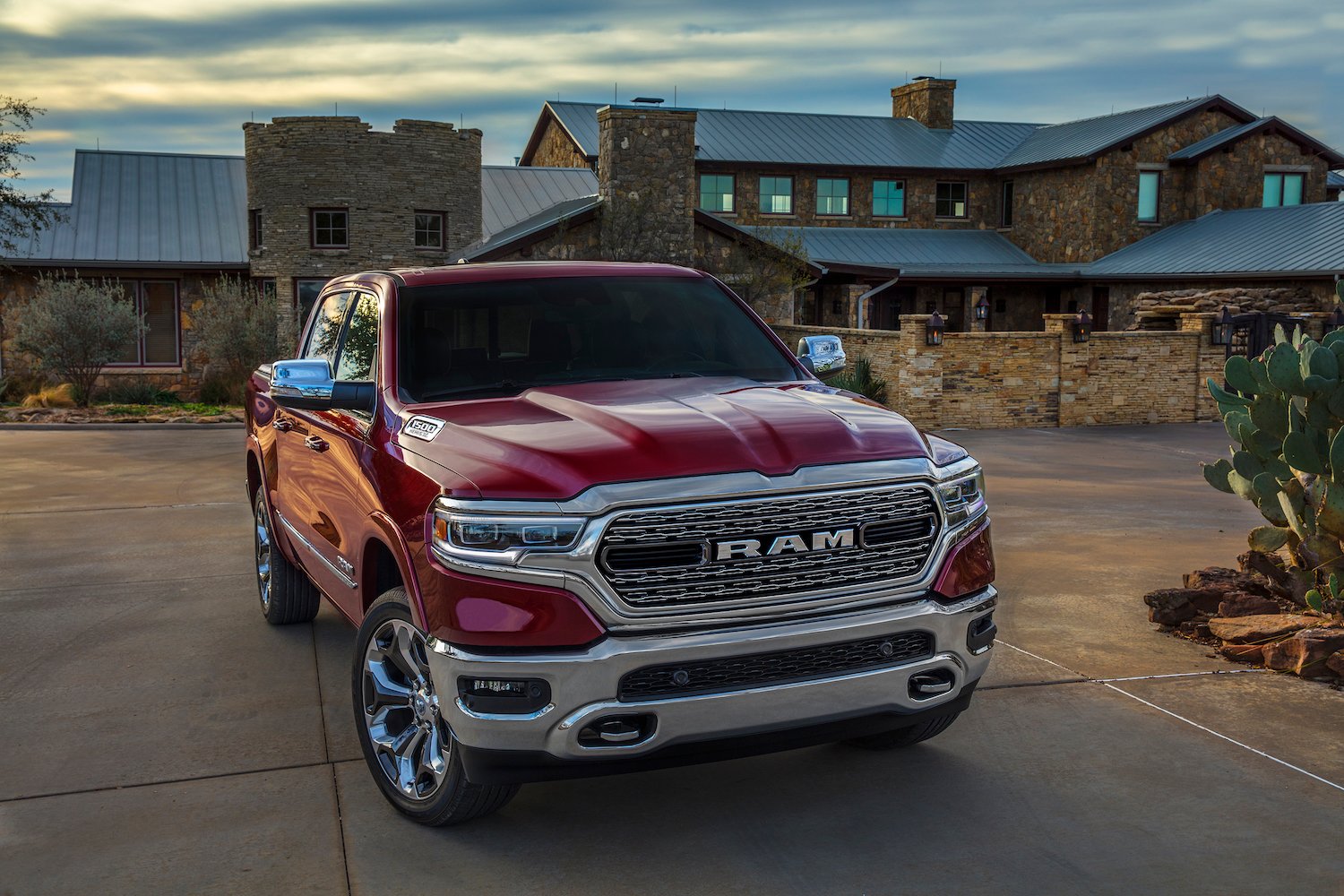A red 2019 Ram 1500 Limited, an upscale full-size pickup truck.