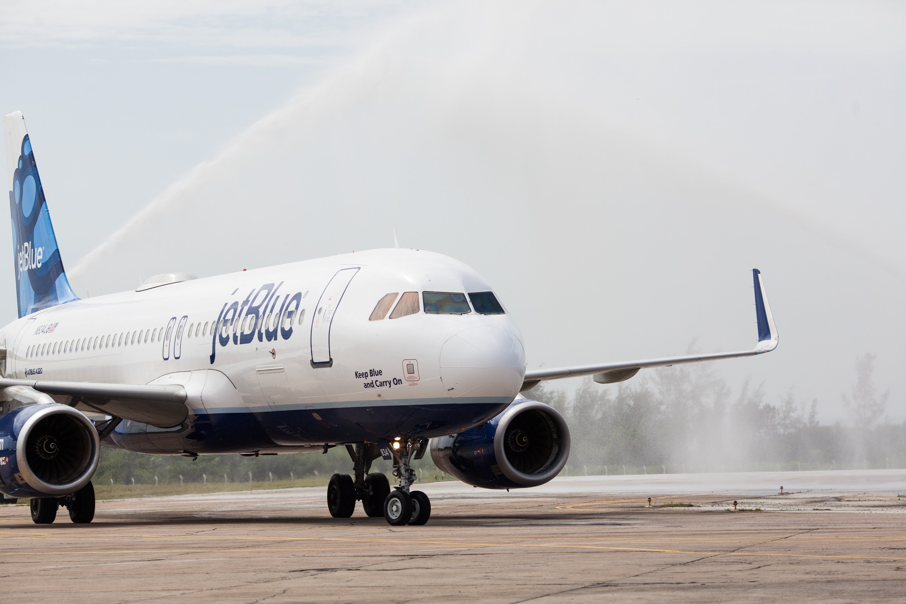 A JetBlue plane landing on the runway