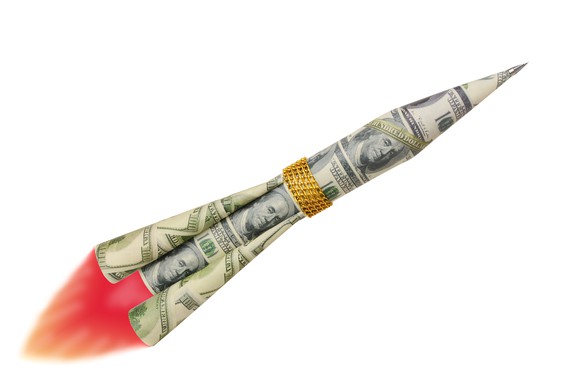 Rocket made out of dollar bills and gold