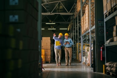 Two men in a warehouse