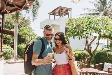 Couple in Tropical Timeshare Resort Courtyard