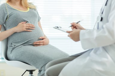 Pregnant women and doctor