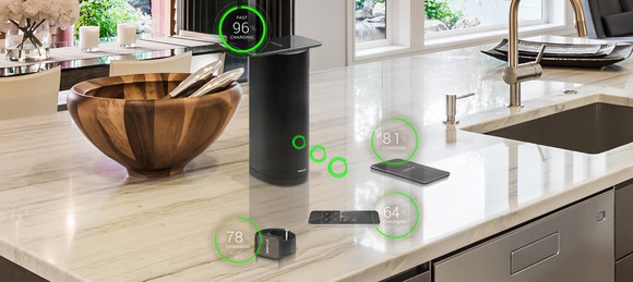 Devices being wirelessly charged in a kitchen.