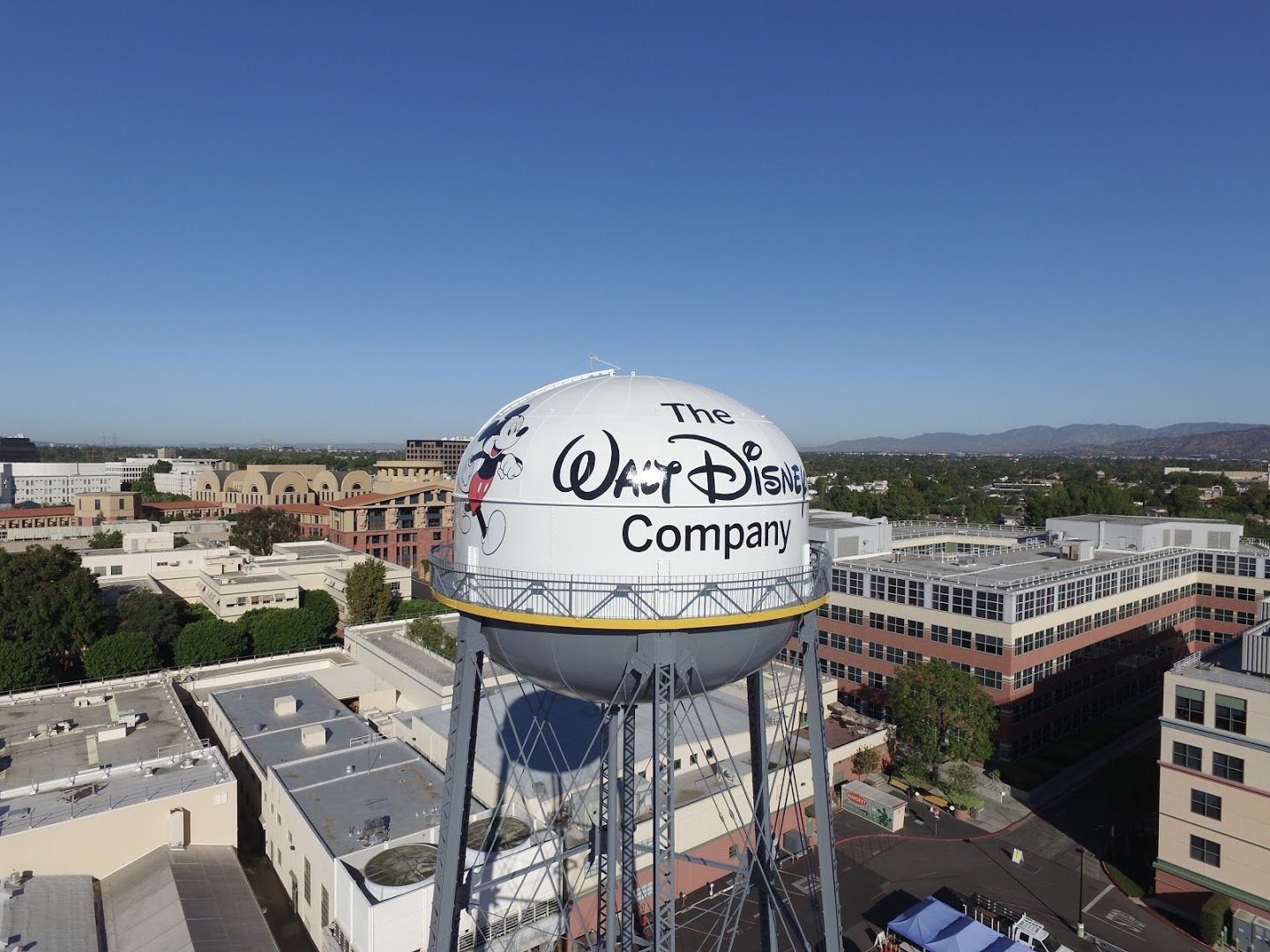 A water tower with The Walt Disney Company logo on it.