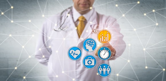 A doctor stands behind connected symbols representing several forms of healthcare data