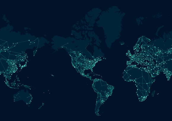 A map of the globe lit up by lights around major cities as if seen from space at night. 