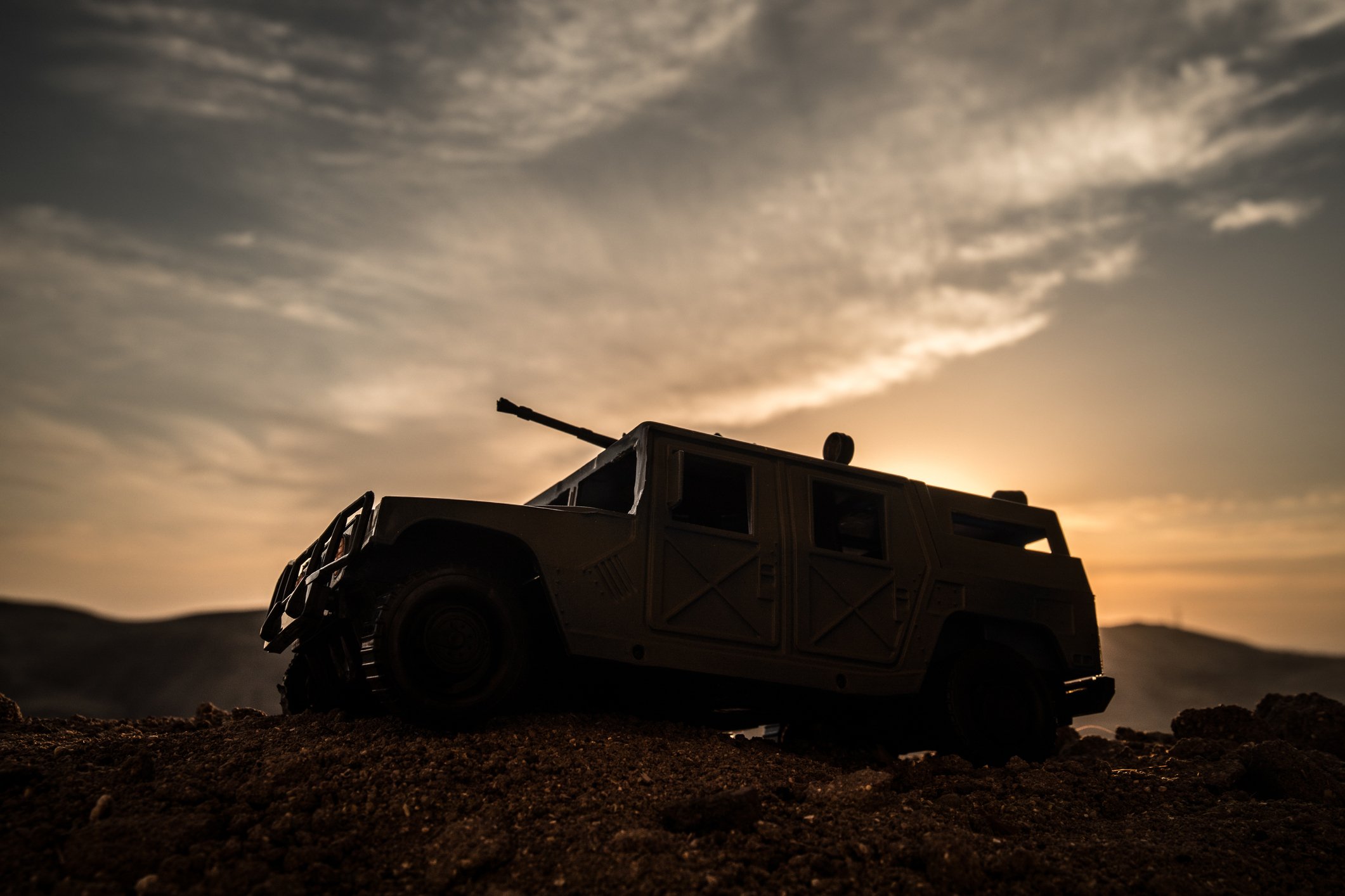 A military vehicle in silhouette