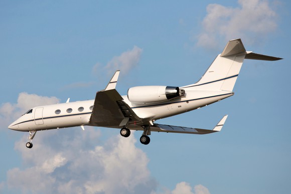Gulfstream jet with landing gear extending